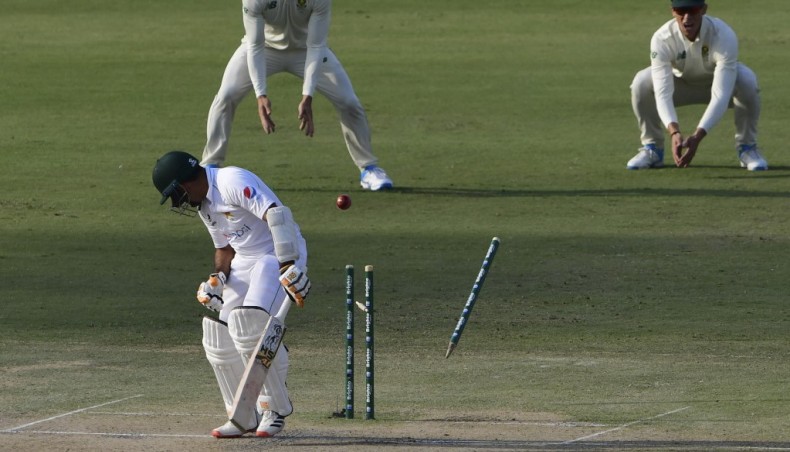 Pakistan's Abid Ali is bowled by South Africa's Kagiso Rabada on the opening day of their first Test at the National Stadium in Karachi on Tuesday. — AFP photo