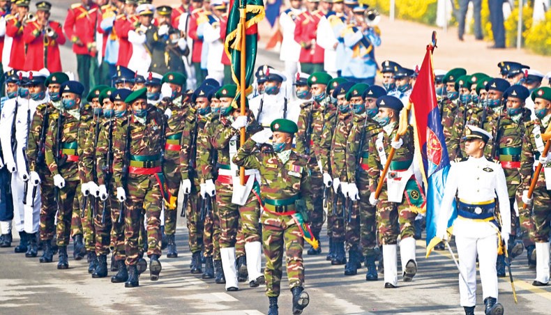 Bangladesh soldiers march along Rajpath in New Delhi during India’s Republic Day parade on Tuesday. — AFP photo