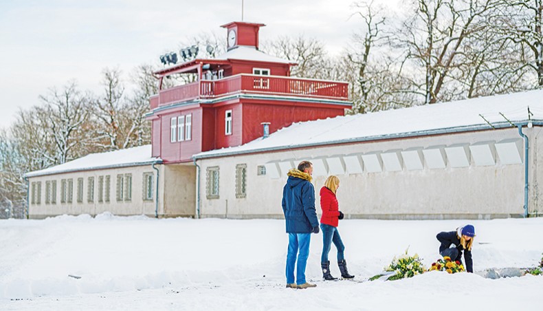 People lay flowers at a commemorative plaque at the memorial site of the former Nazi concentration camp Buchenwald near Weimar, eastern Germany, on Wednesday, the International Holocaust Remembrance Day. — AFP photo