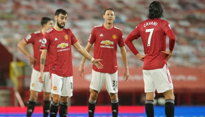 Manchester United players react after conceding their second goal against Sheffield United during their Premier League match at Old Trafford on Wednesday. — AFP photo