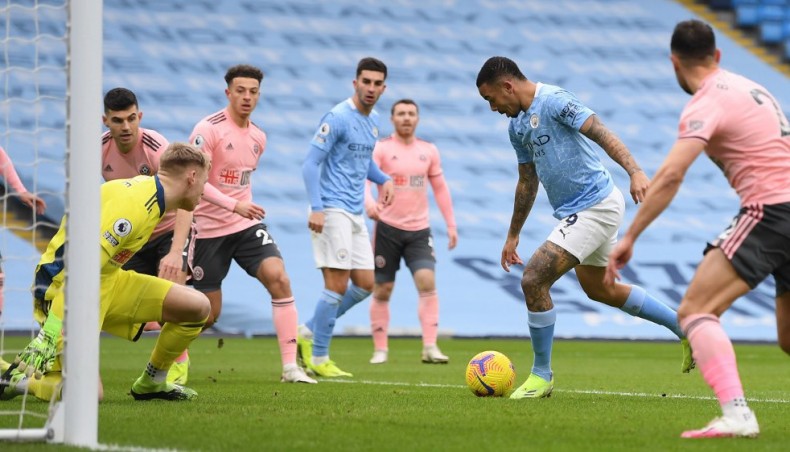 Manchester City striker Gabriel Jesus (2nd-R) scores his team’s opening goal against Sheffield United during their Premier League match at the Etihad Stadium in Manchester on Saturday. — AFP photo