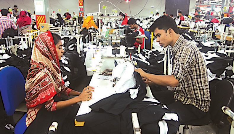 A file photo shows garment workers sewing clothes at a garment factory on the outskirt of Dhaka. Banks are holding up payments to local textile manufacturers against purchase of raw materials by readymade garment exporters under back-to-back letters of credit, textile manufacturers alleged. — New Age photo
