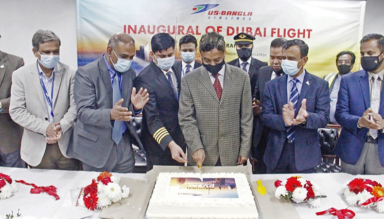 Bangladesh Civil Aviation Authority Chairman Air Vice Marshal M Mofidur Rahman cuts a cake while inaugurating the Dhaka-Dubai flights of US-Bangla Airlines at the International Terminal Building of Hazrat Shahjalal International Airport on Monday. — Press release