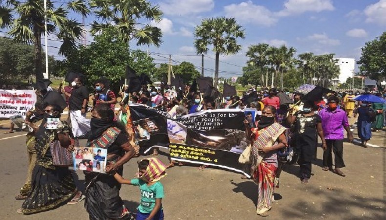 Demonstrators carry black flags and pictures of missing Tamils during a protest march in Sri Lanka’s northern town of Kilinochchi on February 4, 2021.- AFP photo