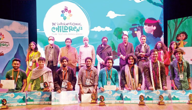 Guests, organisers and award winners pose for a photo at the closing ceremony of 14th International Children’s Film Festival Bangladesh at National Theatre Hall of Bangladesh Shilpakala Academy on Friday. — Sony Ramany
