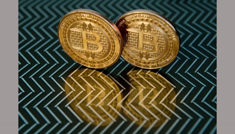 In this file photo taken on June 17, 2014, in Washington, DC shows bitcoin medals. — AFP Photo