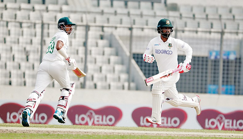 Bangladesh openers Soumya Sarkar (L) and Tamim Iqbal run between the wickets on the fourth day of their second Test against West Indies at the Sher-e-Bangla National Stadium on Sunday. — BCB photo