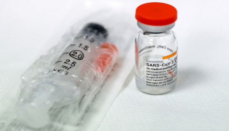 Handout file photo released on January 13, 2021 by the Turkish Ministry of Health press office showing a vial of Chinese-developed Covid-19 vaccine CoronaVac next to a syringe at Ankara's City Hospital.- AFP photo