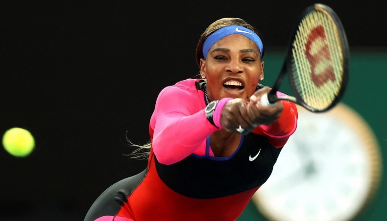 Serena Williams of the US hits a return against Romania's Simona Halep during their women's singles quarter-final match of the Australian Open tennis tournament in Melbourne on Tuesday. — AFP photo