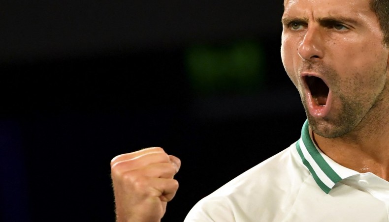 Serbia's Novak Djokovic reacts after a point against Russia's Aslan Karatsev during their men's singles semi-final match of the Australian Open in Melbourne on Thursday. — AFP photo