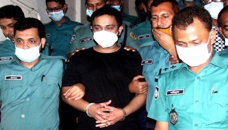 A New Age file photo shows police escorting suspended Dhaka South City Corporation councillor Irfan Salim to court