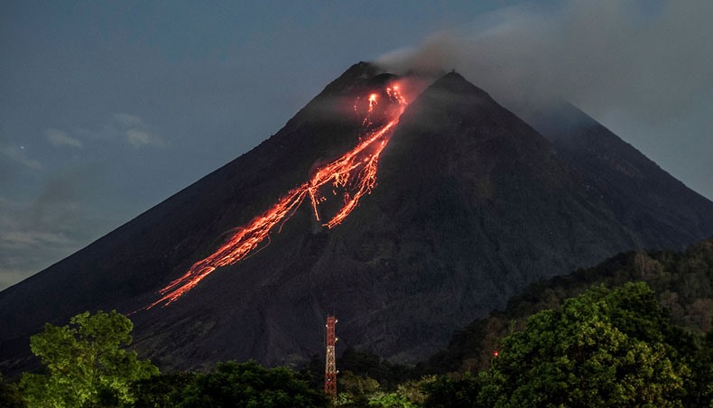 Lava flows down from the crater of Mount Merapi as seen from Kaliurang, in Yogyakarta on February 19, 2021. — AFP photo