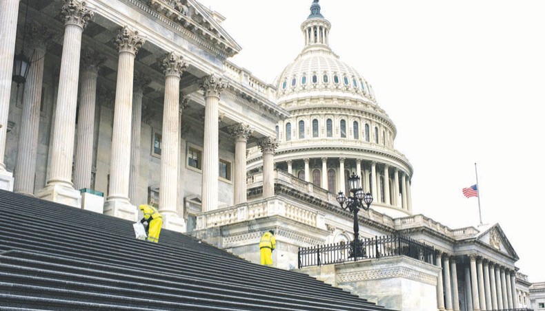 Employees salt the steps leading to the US Capitol following the conclusion of the second impeachment trial of former president Donald Trump on February 13 in Washington, DC. — Agence France-Presse/Getty Images/Brandon Bell