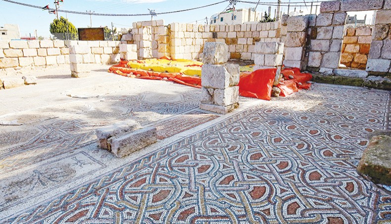 This picture shows the mosaic flooring of the Saint Mary church, built in 543 AD, the restoration of which was recently completed by workers employed by a pilot project run by the UN cultural agency UNESCO, in the small town of Rihab, some 70 kilometres north of the Jordanian capital Amman, on February 9, 2021. — AFP photo