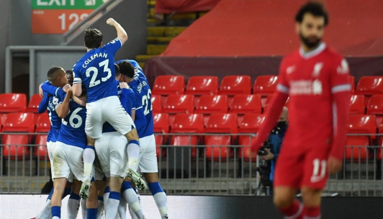 Everton players celebrate their second goal during their Premier League against Liverpool at Anfield on Saturday. — AFP photo