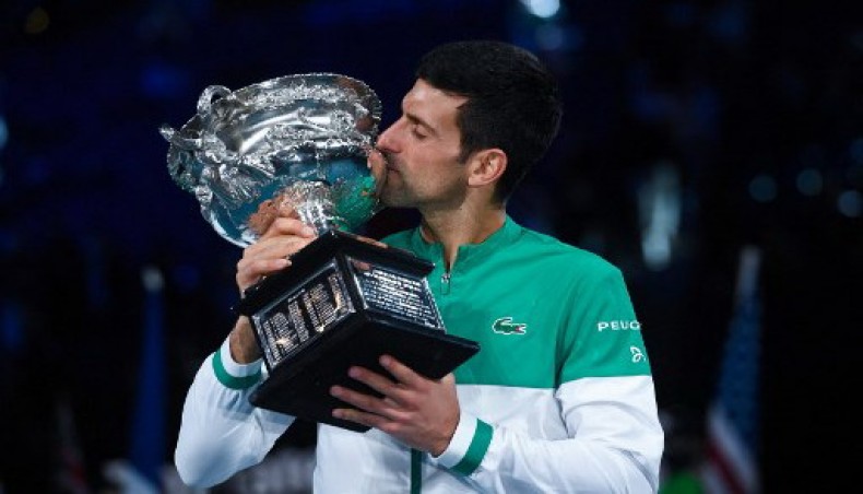 Serbia's Novak Djokovic kisses the trophy following his victory against Russia's Daniil Medvedev in their men's singles final of Australian Open tennis tournament in Melbourne on Sunday.- AFP photo