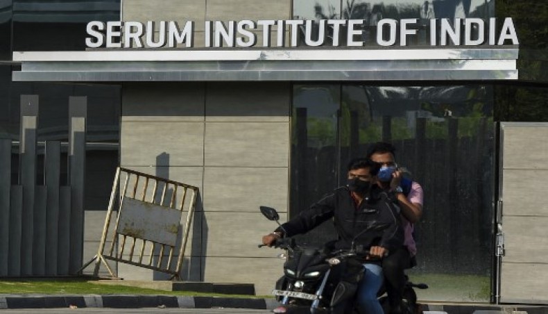 In this file photo taken on January 22, 2021, motorists ride past the entrance of India's Serum Institute in Pune. The world's biggest vaccine maker,- AFP photo