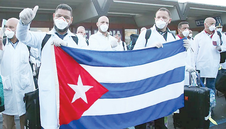 Cuban doctors arrive in Italy to help fight COVID-19 in March 2020. — The Conversation/EPA/Matteo Bazzi