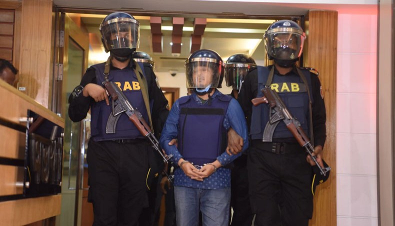 Rapid Action Battalion arrests Mohammad Iqbal, a fugitive convict in the August 21 grenade attack, on Tuesday. — New Age Photo