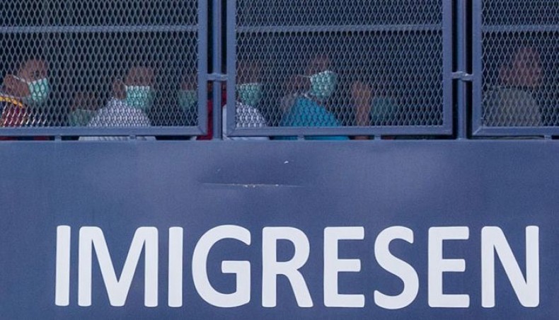 An immigration truck believed to be carrying Myanmar migrants from Malaysia back to their homeland, is seen heading towards the Naval base in Lumut, outside Kuala Lumpur on February 23, 2021. -- AFP photo