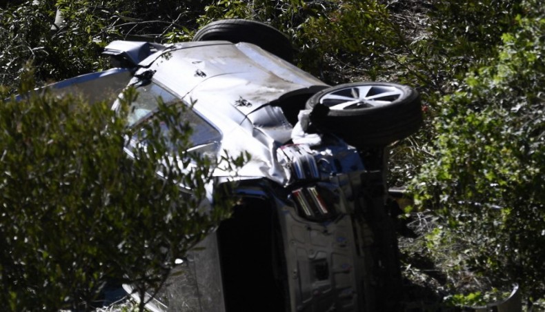 The vehicle driven by golfer Tiger Woods lies on its side in Rancho Palos Verdes, California on Tuesday. — AFP photo