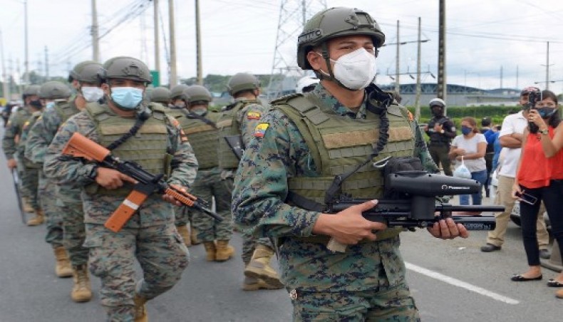 Members of the Ecuadorian Marine Force patrol outside the Zone 8 Deprivation of Liberty Center in Guayaquil, Ecuador, on February 23, 2021. At least 75 inmates died in riots at three prisons in Ecuador on Tuesday, police said.- AFP photo