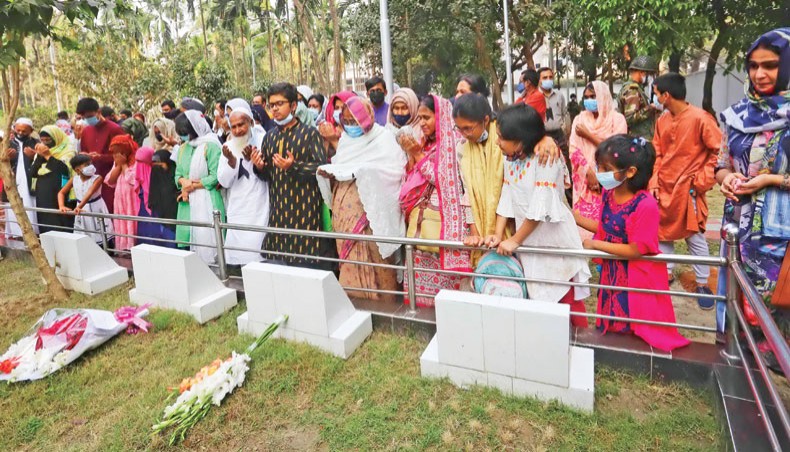 Families of military officers, who were killed during the BDR munity, pray for divine blessings for the salvation of the departed souls at the graveside at Banani Military Graveyard in Dhaka on Thursday. — Sourav Lasker
