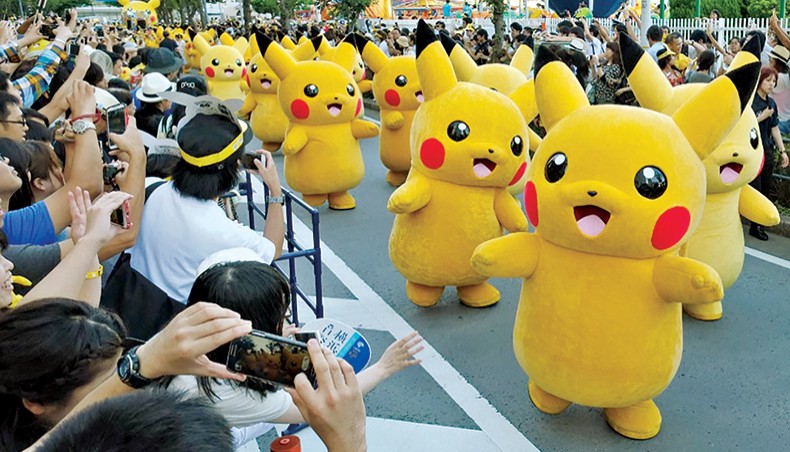 In this file photo taken on August 7, 2016 performers dressed as Pikachu, the popular animation Pokemon series character, perform in the Pikachu parade in Yokohama. — AFP photo