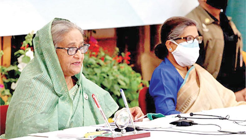 Prime minister Sheikh Hasina, along with her sister Sheikh Rehana, virtually addresses a press conference on Saturday from her Ganabhaban residence over Bangladesh’s advancement to the developing country status. — Focus Bangla photo