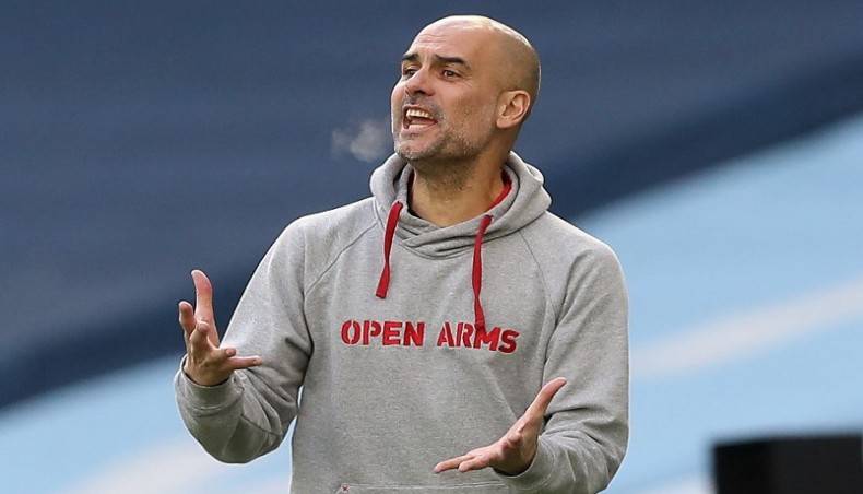 Manchester City manager Pep Guardiola gives instructions to his charges during their Premier League match against West Ham United at the Etihad Stadium on Saturday. — AFP photo