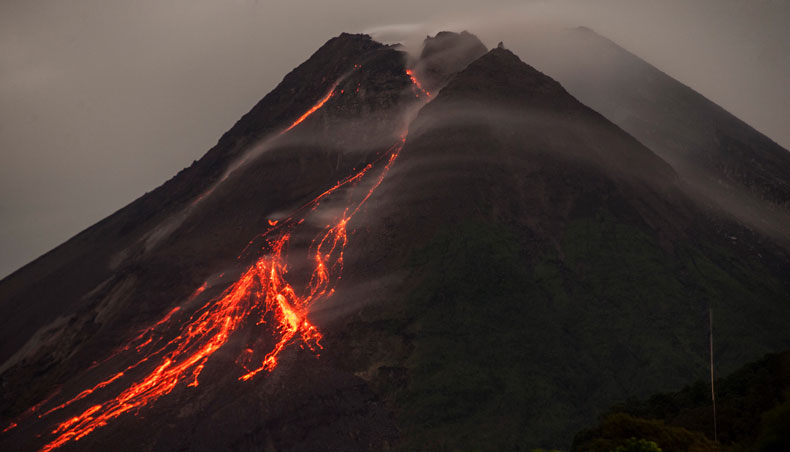 Lava flows down from the crater of Mount Merapi, Indonesia’s most active volcano, as seen from Kaliurang in Yogyakarta on March 1, 2021. — AFP photo