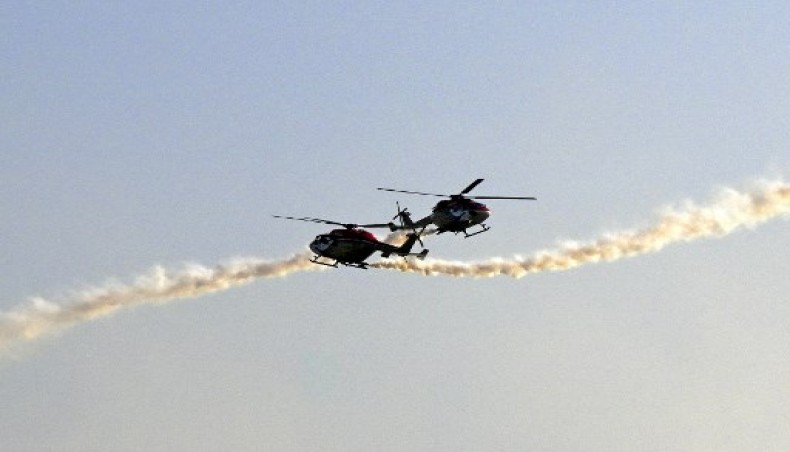 Indian Air Force's Advanced Light Helicopter (ALH) aerobatic team 'Sarang' perform during a rehearsal ahead of 70th anniversary celebrations of the Sri Lankan Air Force in Colombo on March 1, 2021.- AFP photo