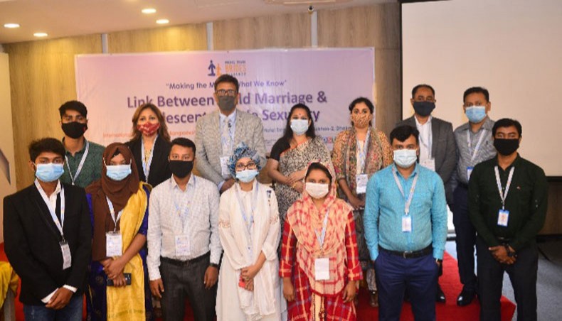Participants pose for a photo session at a three-day event titled ‘Link between child marriage and adolescent female sexuality’ in Dhaka on Tuesday. — Press Release