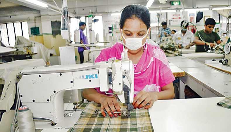 A file photo shows workers sewing clothes at a readymade garment factory on the outskirts of Dhaka. The proportion of female workers in the country’s readymade garment sector declined to 59 per cent in 2020 from 65 per cent in 2015, according to a recent survey conducted by the Asian Center for Development.— New Age photo