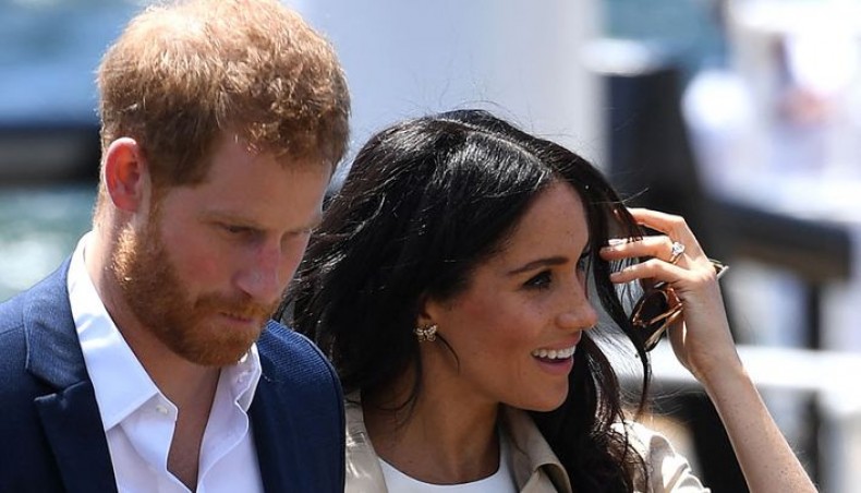 In this file photo Britain's Prince Harry and wife Meghan arrive for a public walk at the Sydney Opera House in Sydney on October 16, 2018. -- AFP photo