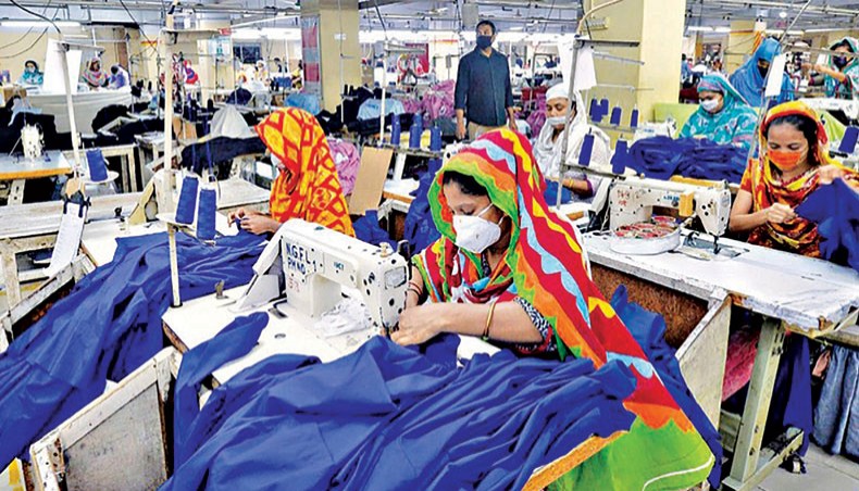 A file photo shows labourers wearing facemasks working at a garment factory in Dhaka. Bangladesh’s export earnings in the July-February period of the current financial year fell by 1.45 per cent to $25.86 billion from $26.24 billion in the same period of the previous fiscal year as the global economic activities remained slow due to the COVID-19 pandemic.— AFP photo