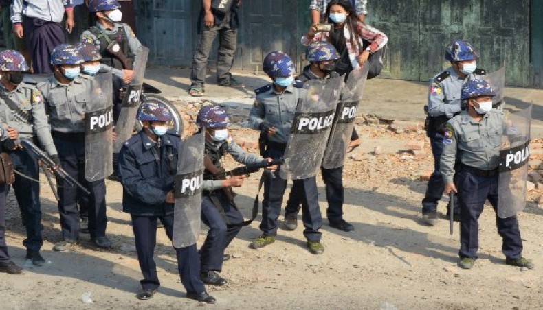 Police face off with protesters during a demonstration against the military coup in the north-western town of Kale on March 2, 2021. — AFP photo