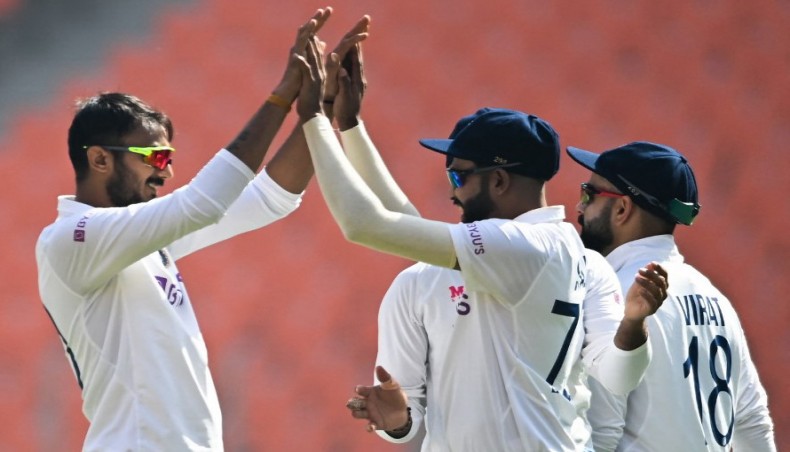 India's Axar Patel (L) celebrates the wicket of England's Zak Crawley with team-mates on the opening day of their fourth Test cricket at the Narendra Modi Stadium in Motera on Thursday. — AFP photo