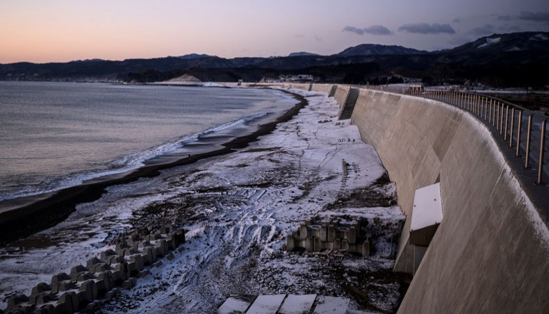 This picture taken on February 27, 2021 shows a newly built sea wall at sunrise in Noda, Iwate Prefecture. -- AFP photo