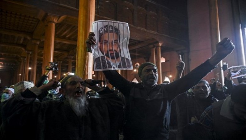 A Kashmiri protestors shout slogans and hold photographs of Mirwaiz Umar Farooq, Kashmir's Chief cleric who has been under house arrest for 20 months, during a protest demanding his release before Friday prayers inside the Jamia Masjid in downtown Srinagar on March 5, 2021.- AFP photo