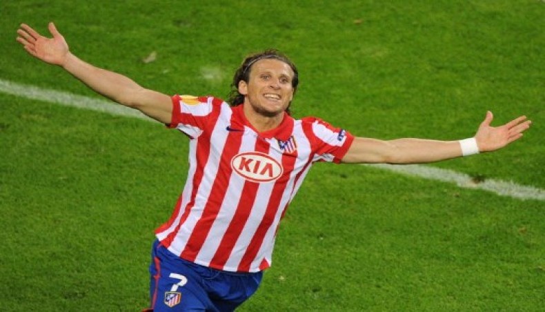 In this AFP file photo taken on May 12, 2010 Atletico Madrid's then Uruguayan forward Diego Forlan celebrates after scoring during the final football match of the UEFA Europa League Fulham FC vs Aletico Madrid in Hamburg, northern Germany.