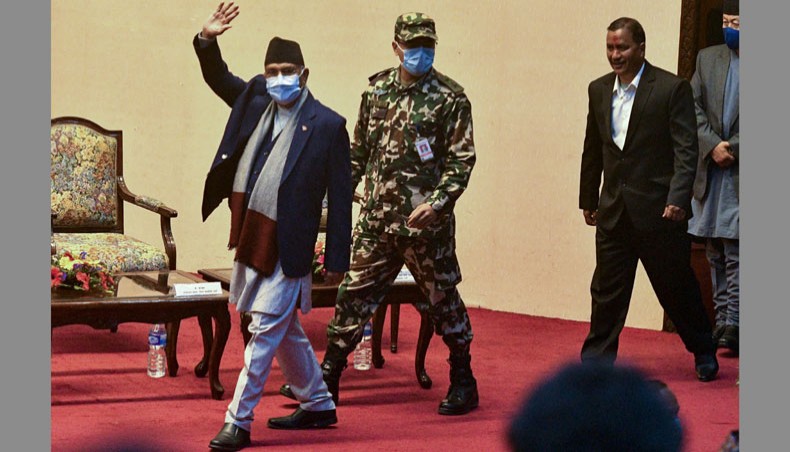 Nepal's Prime minister KP Oli Sharma, left, and Netra Bikram Chand, right, chief of the Nepal Communist Party, a splinter faction of the former rebellion Maoist party, arrive before signing an agreement for the NCP to join peaceful politics, in Kathmandu on March 5, 2021. — AFP Photo