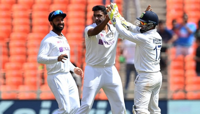 India's Ravichandran Ashwin (C) celebrates the wicket of England’s Zak Crawley with team-mates on the third day of their fourth Test at the Narendra Modi Stadium in Motera on Saturday. — AFP photo