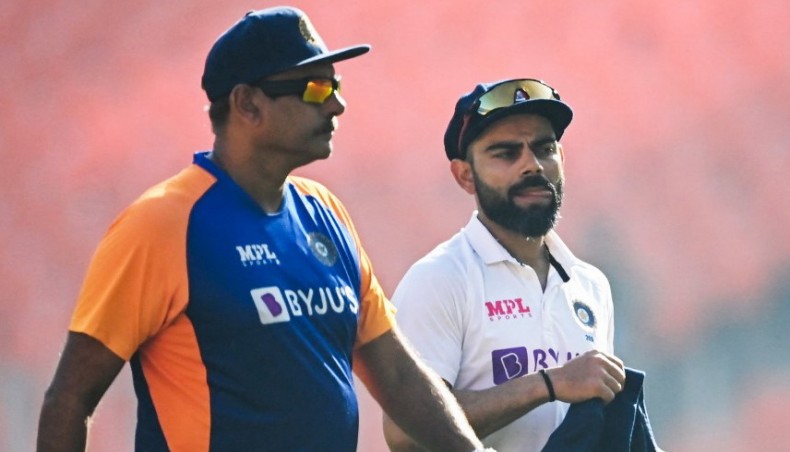 India captain Virat Kohli (R) walks with coach Ravi Shastri before the start of the fourth Test against England at the Narendra Modi Stadium in Motera on March 4, 2021.— AFP photo