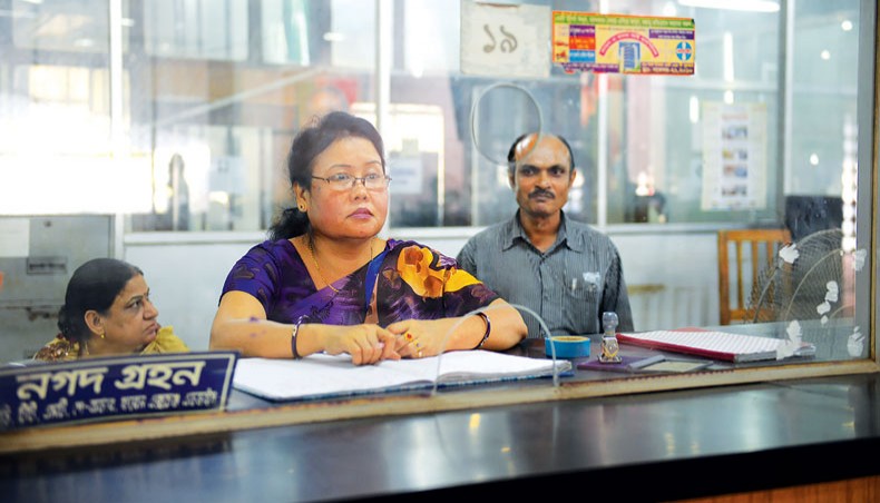 A file photo shows two female employees along with a male staff at a branch of a bank in Dhaka. The number and proportion of female staff in the country’s banking sector dropped in 2020 compared with those in the previous year as employers are still giving preference to men.— New Age photo