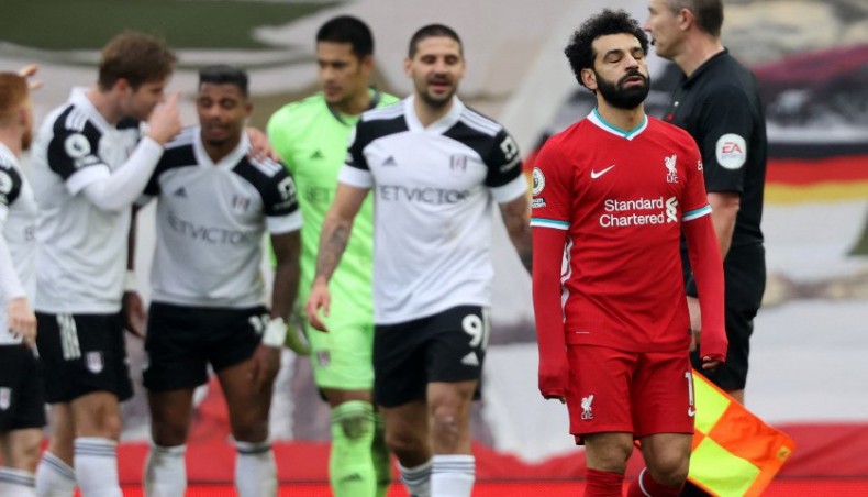 Liverpool midfielder Mohamed Salah (R) reacts at the end of their Premier League match against Fulham at Anfield on Sunday. — AFP photo