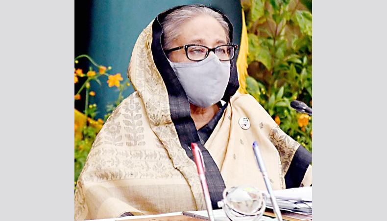 Prime minister Sheikh Hasina presides over the weekly cabinet meeting virtually from her official Ganabhaban residence.- Focus Bangla Photo