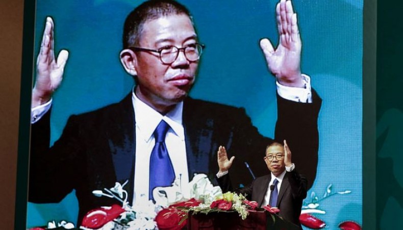 This photo taken on May 6, 2013 shows Zhong Shanshan, chairman of Nongfu Spring mineral water and a separate pharma company, gesturing during a speech at a press conference in Beijing. -- AFP photo