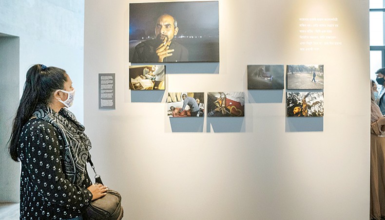 A visitor looks at displayed works at the on-going exhibition titled ‘Snippets Behind Bars and Other Related Stories’ organised by Drik at DrikPath Bhaban at Panthapath. — Sourav Lasker