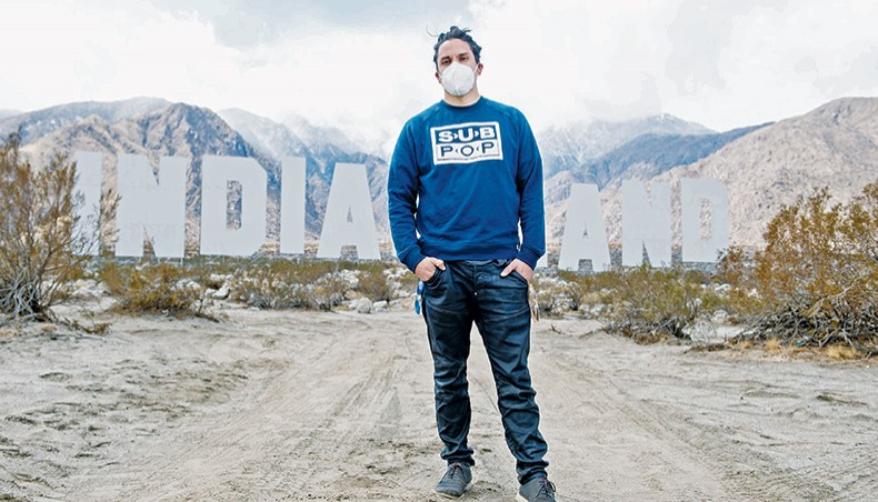 US artist Nicholas Galanino poses in front of his piece, ‘Never Forget,’ during the media preview day of the Desert X exhibit, in the Coachella Valley near Palm Springs, California, on March 11, 2021. — AFP photo